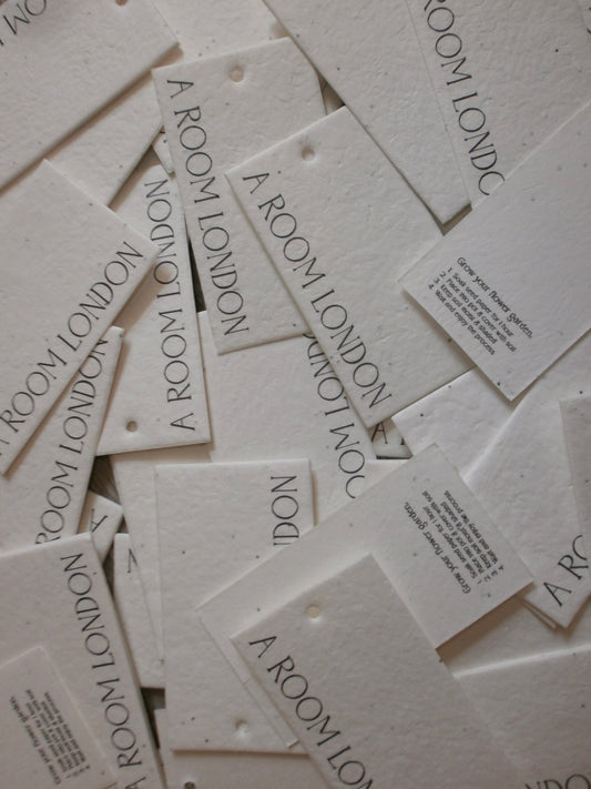 Multiple 'A Room London' branded cards scattered on a light background