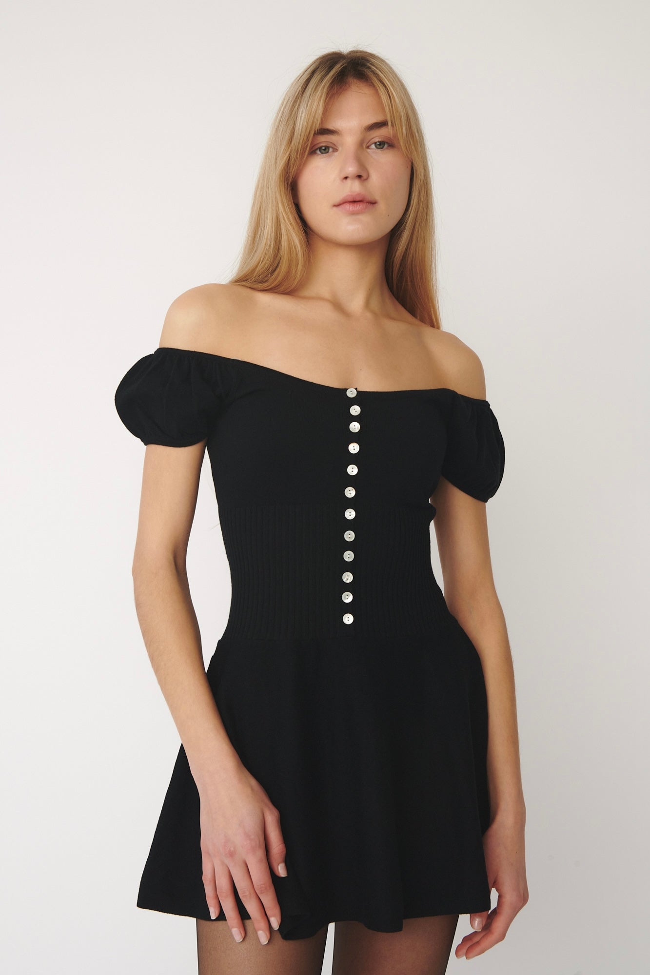 model wearing Lise knitted dress in black designed by A Room London