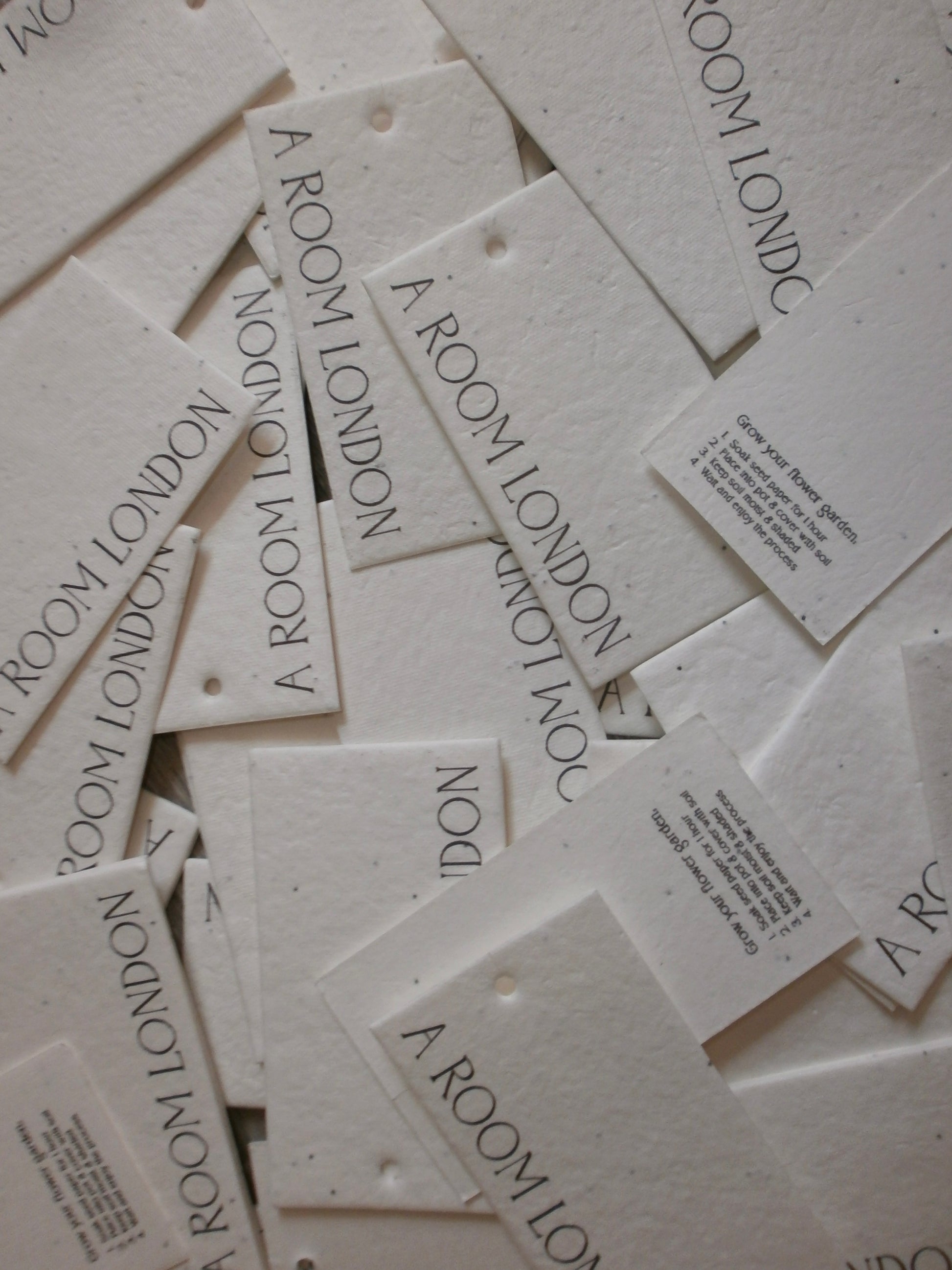 Multiple 'A Room London' branded cards scattered on a light background