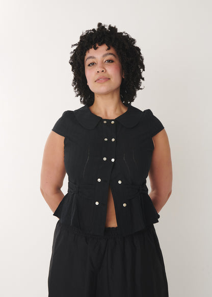 Model wearing the cotton Virginia blouse in black – by A Room London

